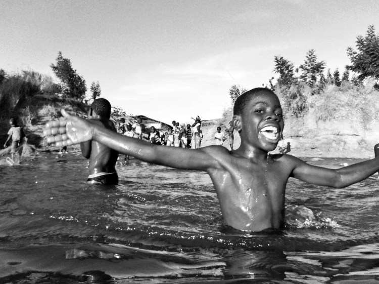 BOY LAUGHING RIVER GAMBIA