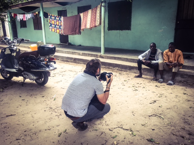 Jason Florio photographing repatriated Gambian, Mohammed, The Gambia © Helen Jones-Florio