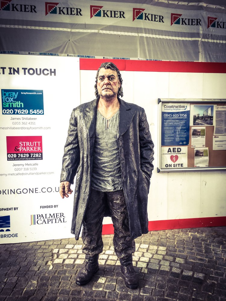 The Wanderer - Sean Henry Sculpture, standing outside Woking train station, Surrey © Helen Jones-Florio