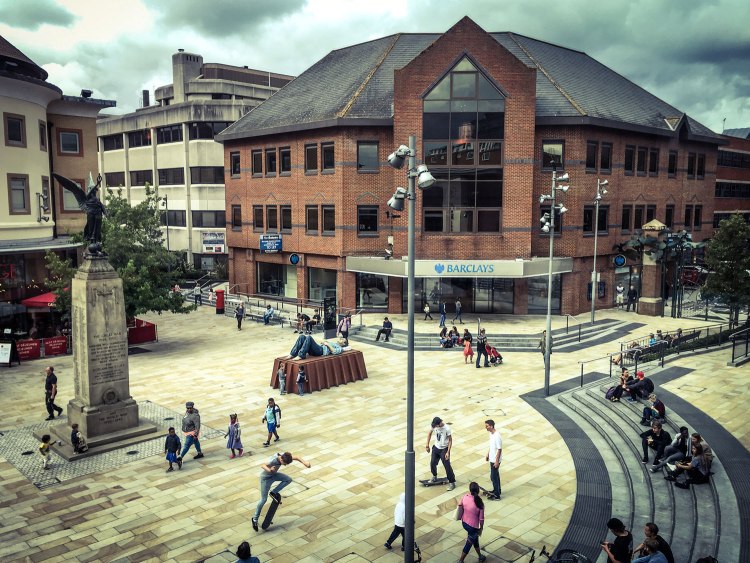 'Catafalque’, 2003 - Sean Henry Sculpture, lies on a rusting steel platform, Jubilee Square, Woking, Surrey © Helen Jones-Florio
