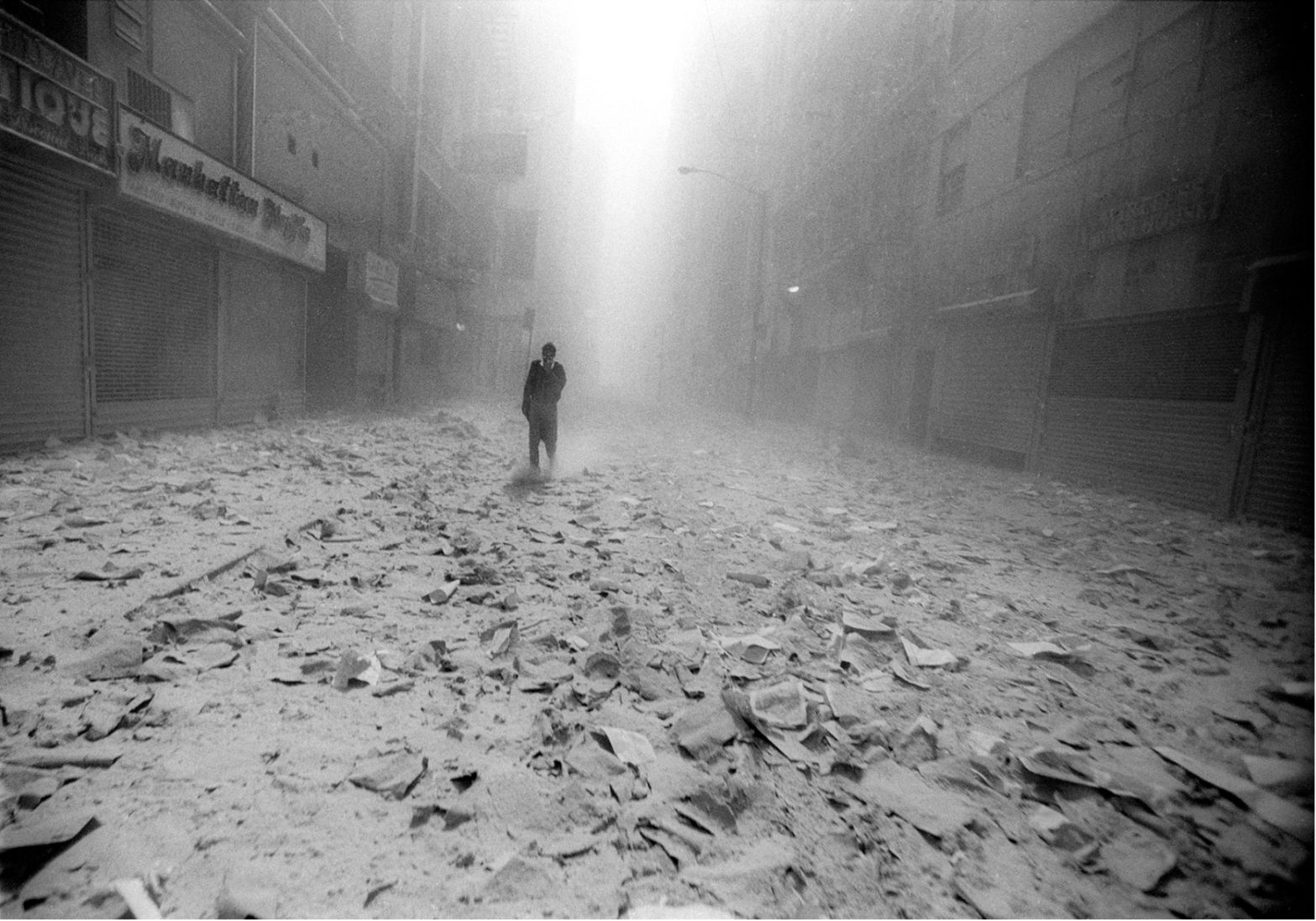 9/11/2001 – A man walks alone in the debris of the South Tower, just a few minutes before the North Tower begins to fall, NYC © Jason Florio