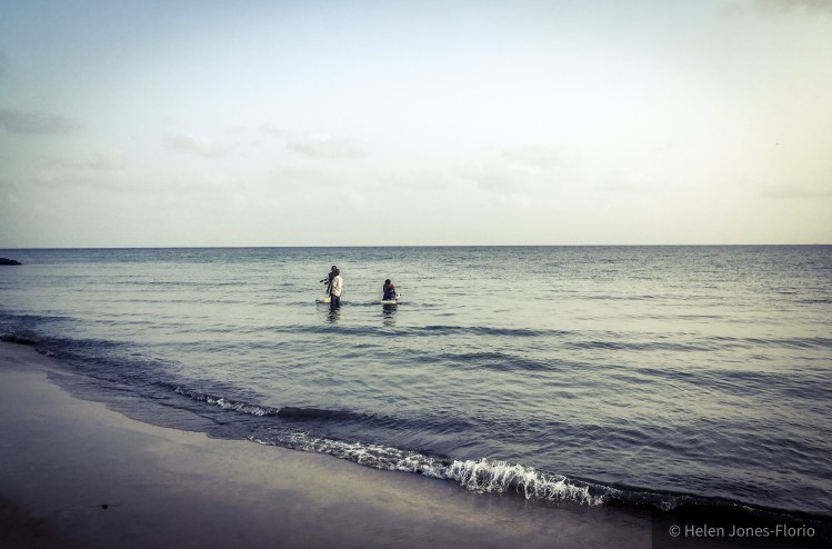 Jason Florio, filming, wading in the Atlantic Ocean, The Gambia ©Helen Jones-Florio