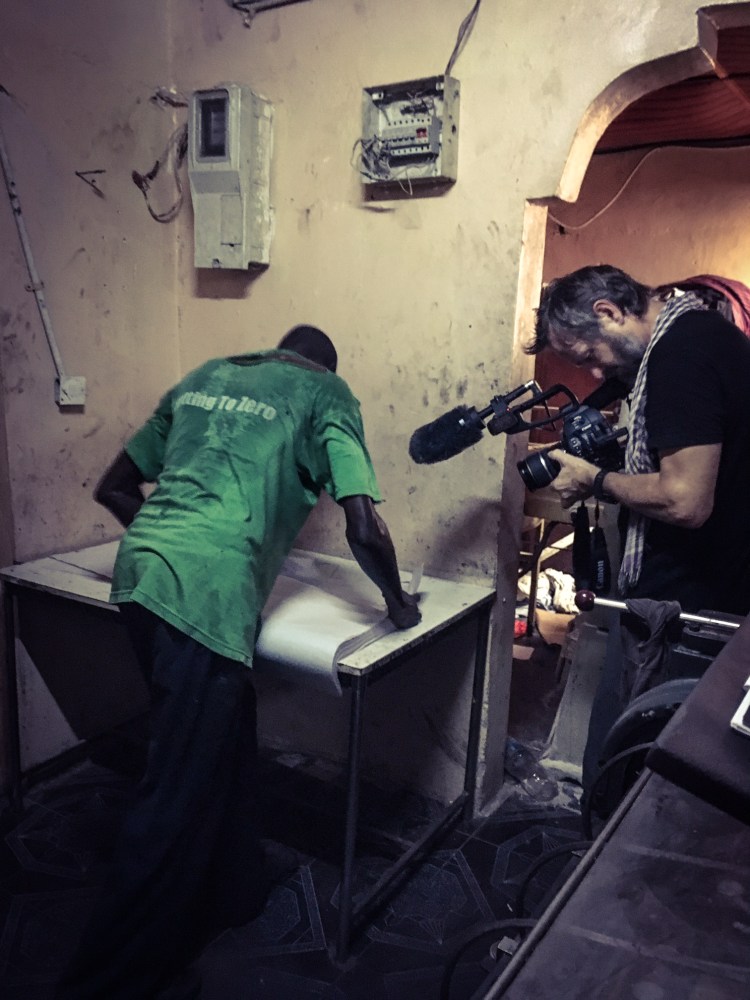 Jason Florio filming at the Foroyaa newspaper print shop ©Helen Jones-Florio (2nd Camera)