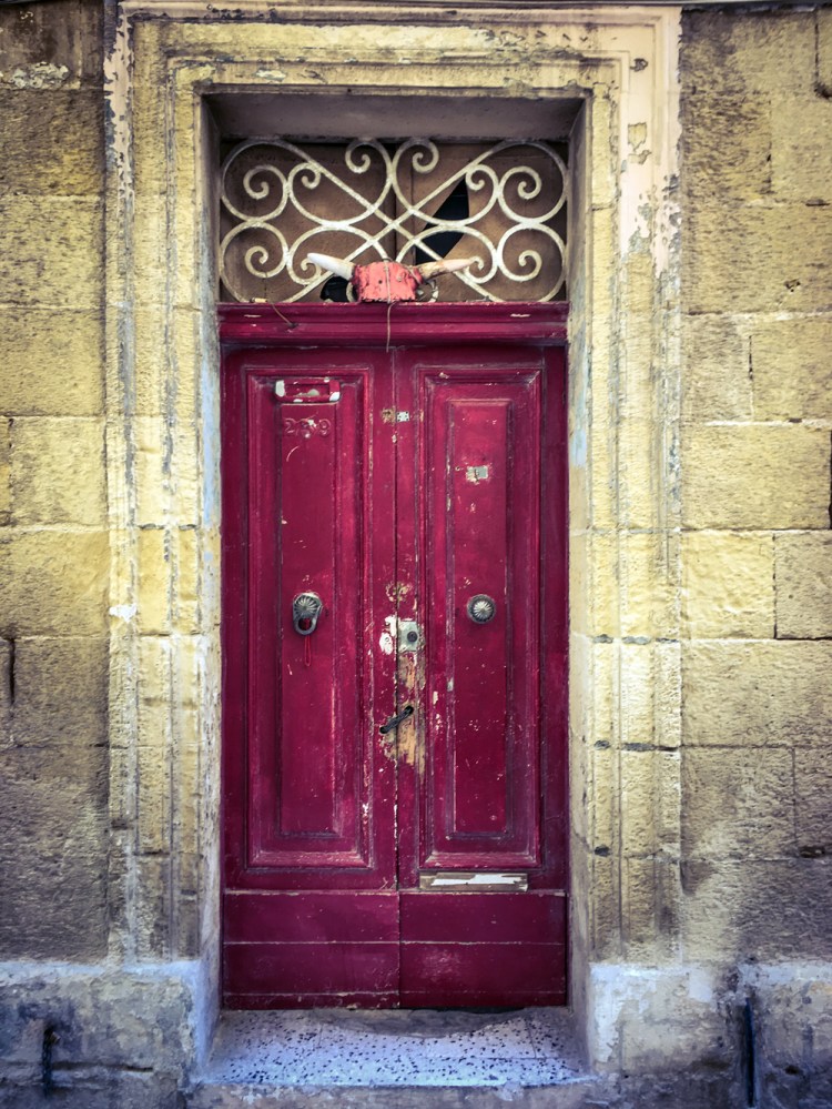 Old red doors of derelict house, Sqaq Santa Liena, Bormla, Malta ©Helen Jones-Florio
