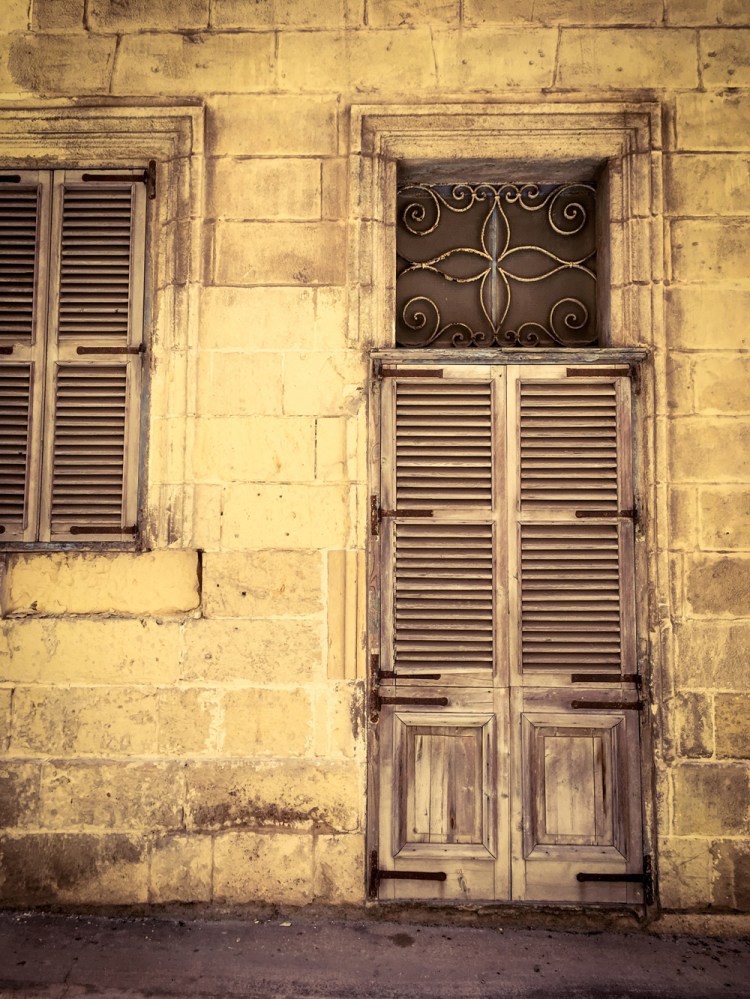 Shuttered doors and windows, facade of derelict house, Triq Felic, Bormla, Malta ©Helen Jones-Florio