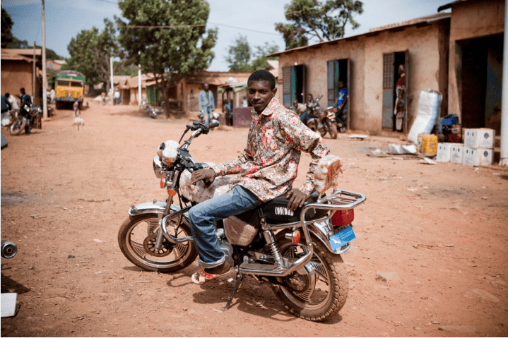 River Gambia Expedition: Moto Taxi rider, Ebu, Mali Ville, Fouta Djallon Highlands, Guinea-Conakry © Jason Florio