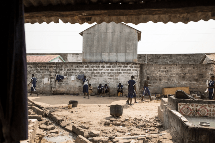 Exclusive images from Inside the notorious Mile 2 Prison, The Gambia   – prisoners in the main exercise yard of the prison  – image ©Helen Jones-Florio 