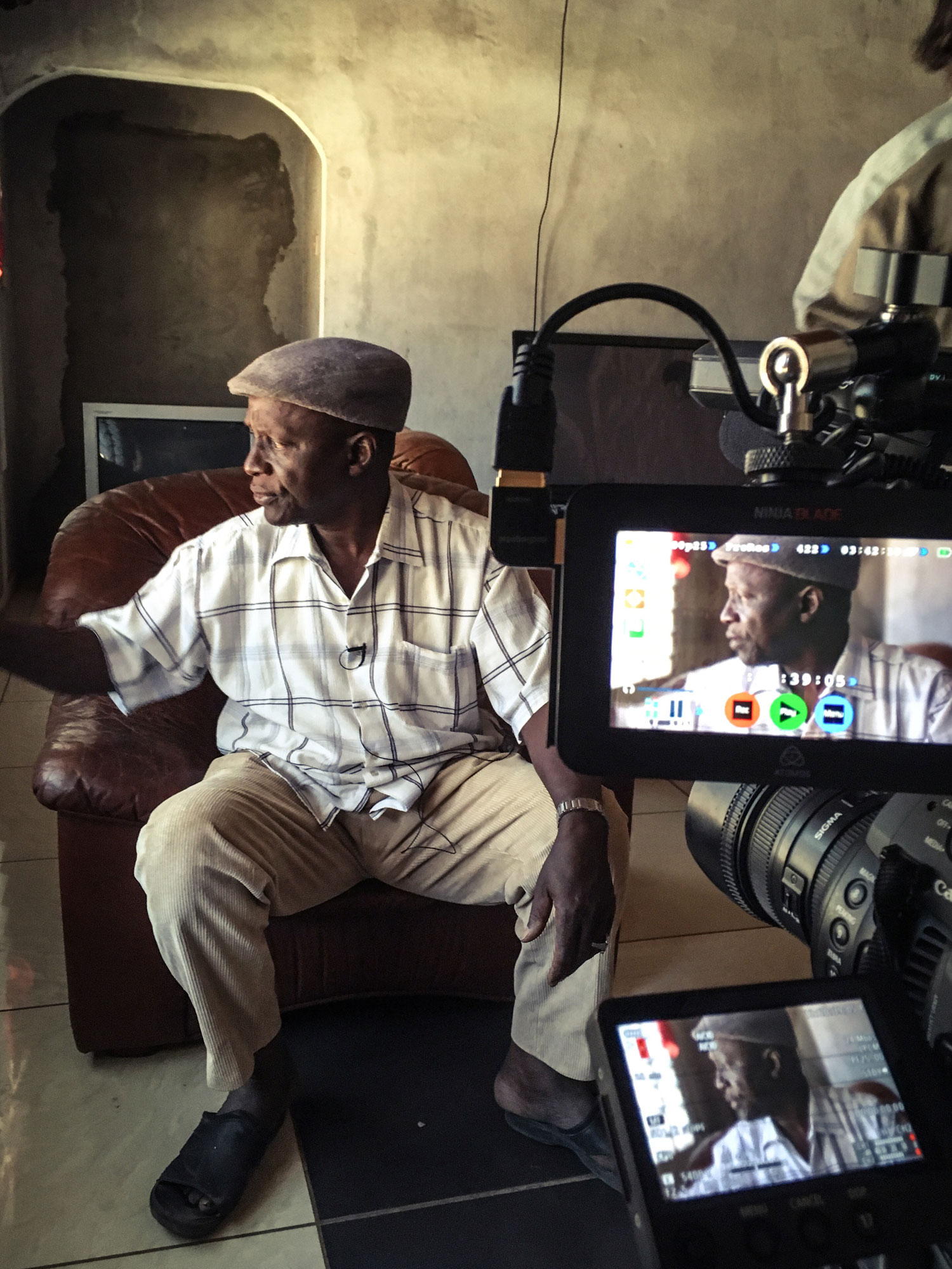 Gambian, Mbye Babou Chune gives his testimony, on camera, about the murder of his 14-year-old-son © Helen Jones-Florio, The Gambia, West Africa.