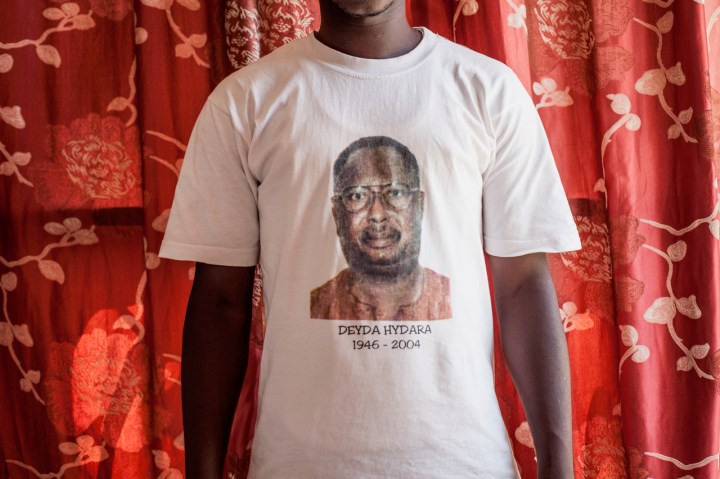 Gambia - victims and resisters: portrait of a man wearing a t-shirt with a photo of murdered newspaper editor and journalist, Dedyra Hydara ©Jason Florio