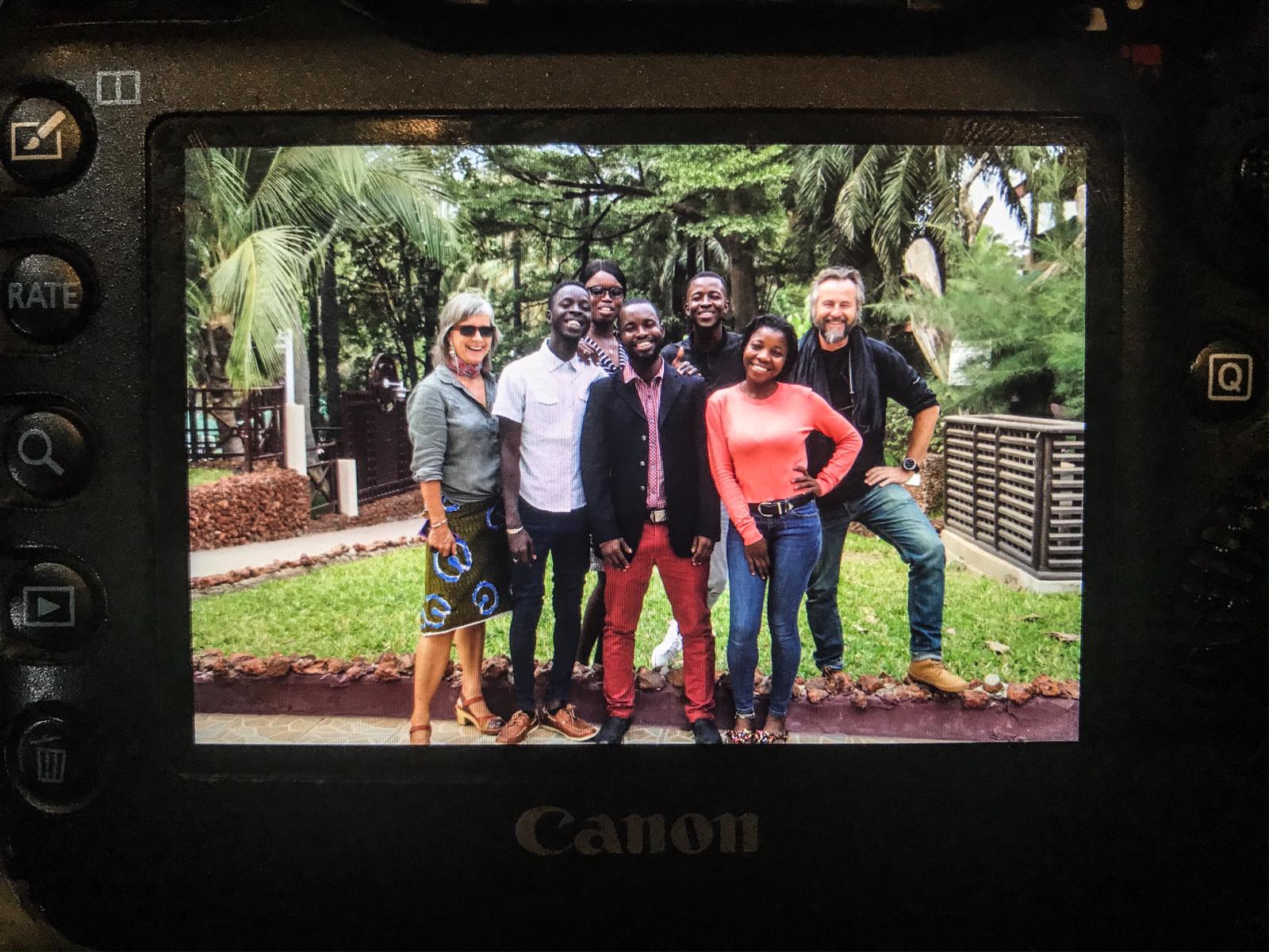 Group shot of photography workshop facilitators, Jason Florio & Helen Jones-Florio with IOM photojournalists