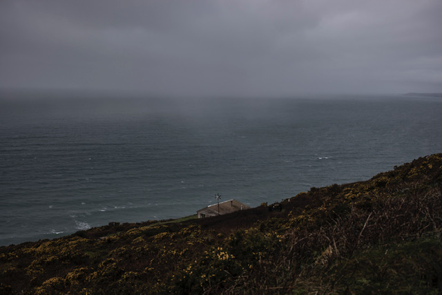 (self) Isolation - image © Jason Florio - a lone beach hut, on the cliffside, overlooking the sea, Cornwall, UK