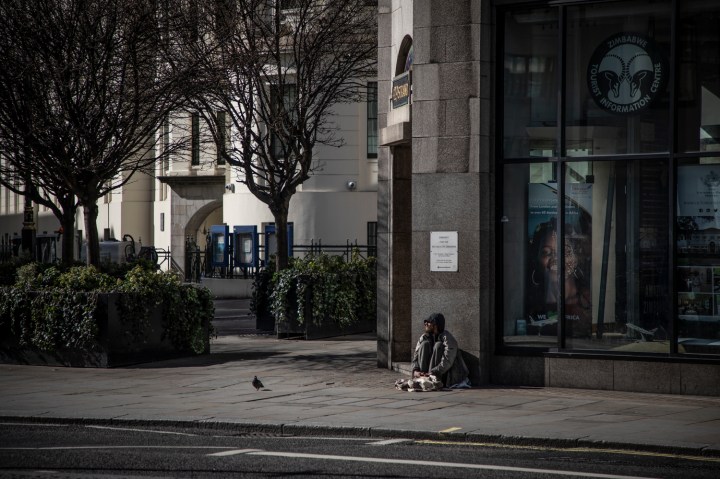 COVID 19 London lockdown. Homelessness - a lone homeless man sits on the street, Central London. Image © Jason Florio
