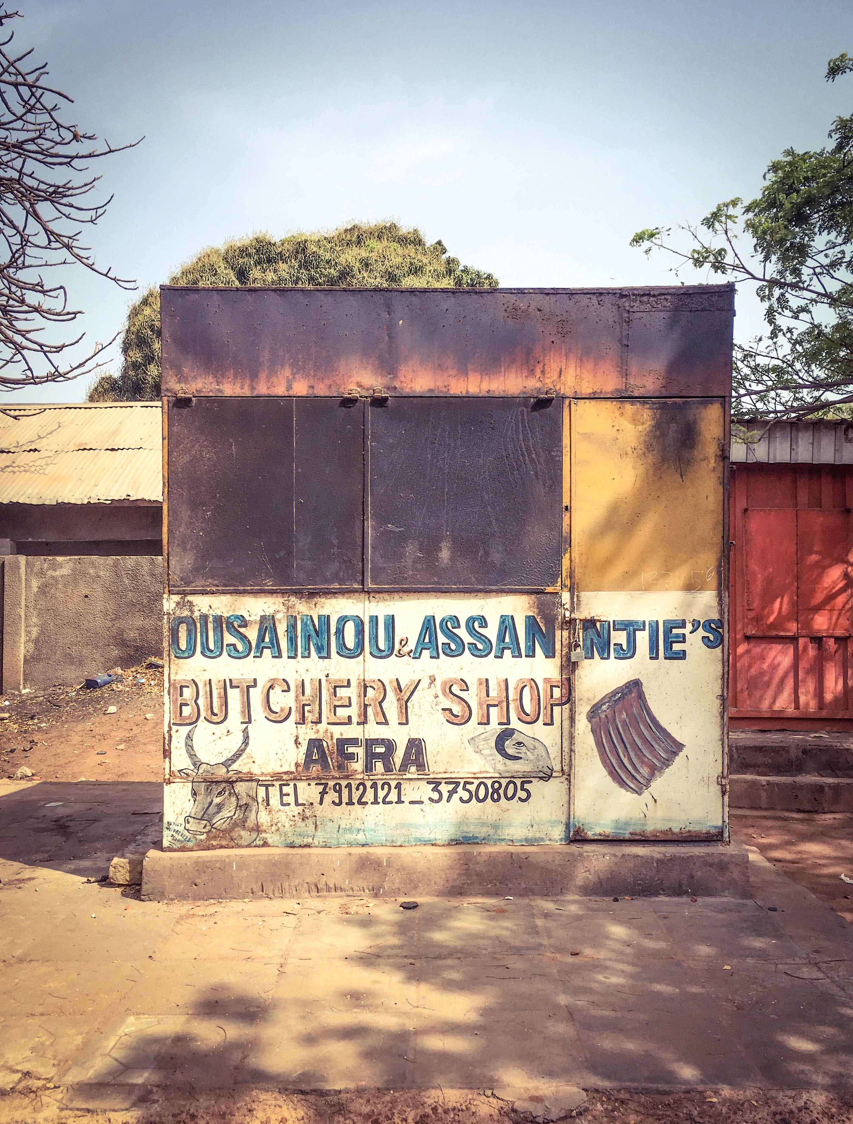 Doors & Storefronts - The Gambia, West Africa: local butchers shop & 'Afra', Bakau. Image © Helen Jones-Florio