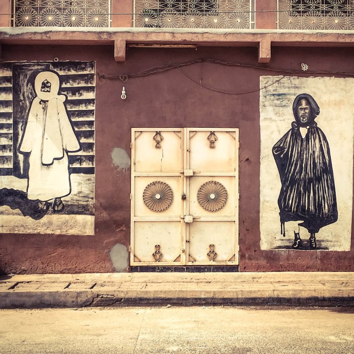 #GambiaDoors: Doors & Storefronts - The Gambia, West Africa. Mural's depicting the Mouride Brotherhood's, Lamp Faal and Baye Faal.
