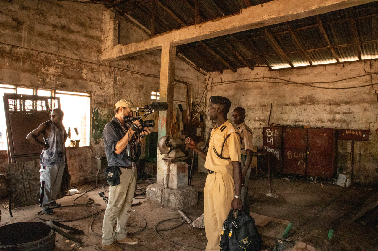 Photographer/filmmaker, Jason Florio filming inside the notorious Mile 2 Prison, The Gambia, West Africa. Image © Helen Jones-Florio