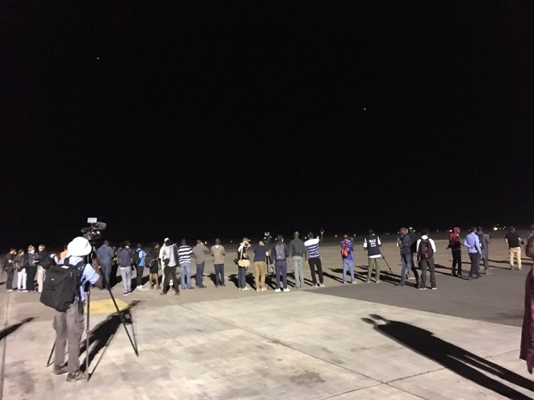Gambia Has Decided: the international press watch as the plane carrying ex-president of the Gambia, Yahya Jammeh, flies off into exile. Image © Jason Florio Jan 21st 2017