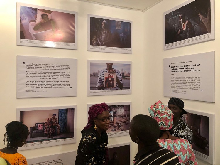 Opening of 'Memory House', The Gambia, West Africa. A group of Gambian women looking at the exhibition. Images ©Jason Florio & Helen Jones-Florio from 'Gambia - victims, and resisters'
