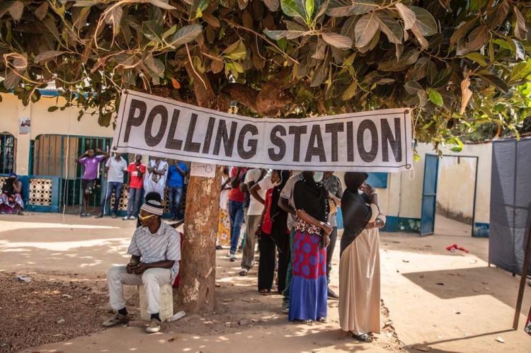 Gambia Elections 2021 - people line up to vote at a polling station. Image © Jason Florio