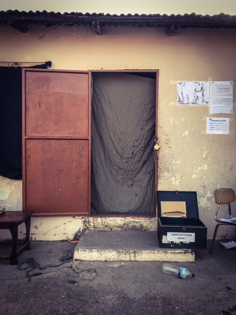 Gambia Elections 2021 - the end of the voting day, the curtain doorway to a voting room lays dormant. Image © Helen Jones-Florio
