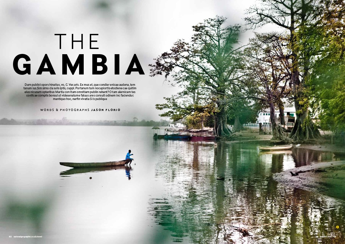 National Geographic Traveller - opening page depicting a young boy fishing from a dug out canoe, in the early morning, on the River Gambia, The Gambia, West Africa. Image ©Jason Florio