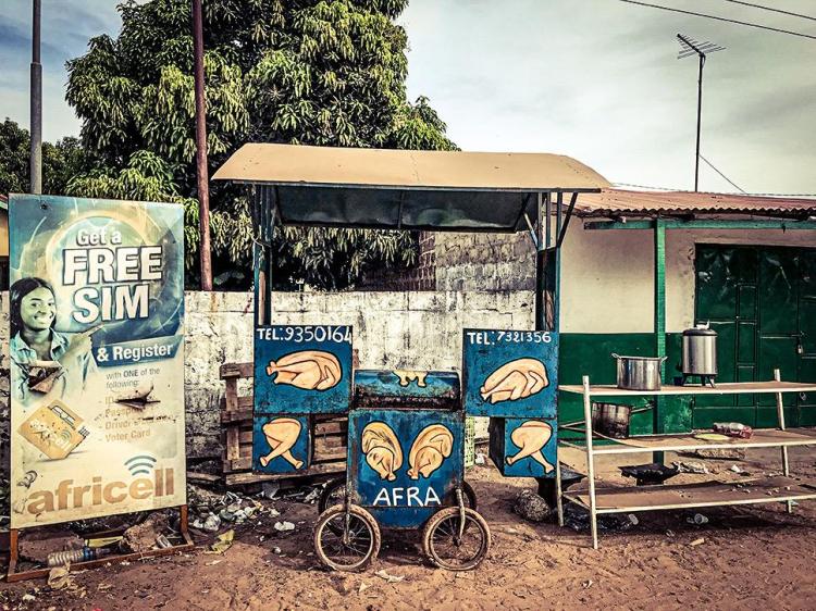 A mobile meat cart on a an urban street in The Gambia. Image © Helen Jones-Florio